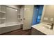Clean bathroom featuring a shower-tub combo, a single sink vanity, and neutral decor at 8703 Ellington Park Dr, Charlotte, NC 28277