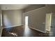 Spacious bedroom features wood-look flooring, vaulted ceiling, and en suite bathroom at 8703 Ellington Park Dr, Charlotte, NC 28277