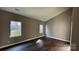 This bedroom is spacious, has wood-look flooring and lots of natural light at 8703 Ellington Park Dr, Charlotte, NC 28277