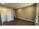 Neutral bedroom with walk-in closet, hardwood floors, and plenty of natural light at 8703 Ellington Park Dr, Charlotte, NC 28277
