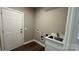 Spacious laundry room with a utility sink and a door to the outside at 8703 Ellington Park Dr, Charlotte, NC 28277