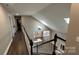Hallway view showcasing the living room with an open layout and fireplace at 8703 Ellington Park Dr, Charlotte, NC 28277