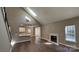 Open-concept living room features fireplace, hardwood floors, and lots of natural light at 8703 Ellington Park Dr, Charlotte, NC 28277