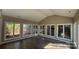 Sunroom filled with natural light and backyard views is the perfect space for relaxation at 8703 Ellington Park Dr, Charlotte, NC 28277