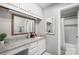 Well-lit bathroom featuring a granite countertop vanity and a shower-tub combo with white subway tile at 1420 11Th Street Nw Dr # 15, Hickory, NC 28601