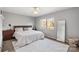 Comfortable bedroom with a plush bed, neutral decor, and a large window at 1420 11Th Street Nw Dr # 15, Hickory, NC 28601
