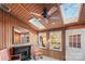 Cozy sunroom with wood paneling, skylights, fireplace and comfortable seating at 1420 11Th Street Nw Dr # 15, Hickory, NC 28601