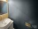 Stylish bathroom featuring a vessel sink, modern fixtures, and a decorative vanity at 11124 Chastain Parc Dr, Charlotte, NC 28216