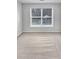 Bright bedroom featuring neutral carpet, white walls, and a window with natural light at 11124 Chastain Parc Dr, Charlotte, NC 28216