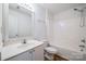 Well-lit bathroom featuring a vanity with a large mirror and a shower-tub combo with white tile surround at 11426 Savannah Creek Dr, Charlotte, NC 28273