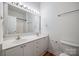 Bright bathroom with dual sinks, a large mirror, and plenty of counter space at 11426 Savannah Creek Dr, Charlotte, NC 28273