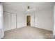 Bedroom with carpeted floors, ceiling fan, and a double-door closet at 11426 Savannah Creek Dr, Charlotte, NC 28273