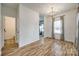Bright dining room with stylish floors, modern lighting, and large window with natural light at 11426 Savannah Creek Dr, Charlotte, NC 28273