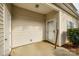 Cozy front porch with siding and concrete floor, featuring the front door with visible house number at 11426 Savannah Creek Dr, Charlotte, NC 28273