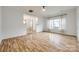 Large living room boasting an open layout, ceiling fan, and hardwood style floors at 11426 Savannah Creek Dr, Charlotte, NC 28273