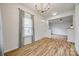 Open-concept living room with new flooring, neutral colors, and plenty of space for entertaining at 11426 Savannah Creek Dr, Charlotte, NC 28273
