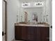 Bathroom features a dark wood vanity with granite countertops, dual sinks, and a glass enclosed shower at 122 N Longfellow Ln, Mooresville, NC 28117