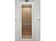 Modern elevator with wood-paneled interior and glass door at 122 N Longfellow Ln, Mooresville, NC 28117
