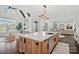 Beautiful kitchen with white countertops, wood accents, and bright open concept living space at 122 N Longfellow Ln, Mooresville, NC 28117