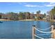 Scenic lake view from property with a pier and golf course views at 122 N Longfellow Ln, Mooresville, NC 28117