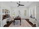 Bright office with built-ins, a ceiling fan, a traditional desk, and large windows at 122 N Longfellow Ln, Mooresville, NC 28117