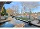 Luxury home featuring an outdoor pool, patio and lake views at 122 N Longfellow Ln, Mooresville, NC 28117