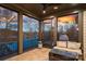 Cozy screened porch with lake views and comfortable seating at 122 N Longfellow Ln, Mooresville, NC 28117