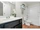 Well-maintained bathroom with a modern vanity and shower at 137 Woodbridge Cir, Mount Holly, NC 28120