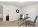 Cozy room featuring double doors and view to the ensuite bathroom at 137 Woodbridge Cir, Mount Holly, NC 28120