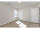 Inviting room with neutral walls and lots of natural light at 137 Woodbridge Cir, Mount Holly, NC 28120