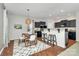 Cozy dining area with modern lighting, laminate floors, and seamless integration with the kitchen at 137 Woodbridge Cir, Mount Holly, NC 28120