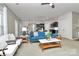 Spacious living room featuring stylish decor, a view of the kitchen, and abundant natural light at 137 Woodbridge Cir, Mount Holly, NC 28120