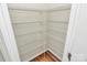 Walk-in pantry featuring wire shelving for maximum storage space, providing an organized kitchen solution at 137 Woodbridge Cir, Mount Holly, NC 28120
