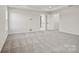 Spacious main bedroom with plush carpet, ample natural light, and a walk-in closet at 13705 Roderick Dr # 194, Huntersville, NC 28078