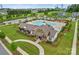 Aerial view of the community pool and clubhouse surrounded by lush landscaping at 13705 Roderick Dr # 194, Huntersville, NC 28078