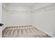 This spacious walk-in closet features carpeted floors and white walls with metal shelving at 13705 Roderick Dr # 194, Huntersville, NC 28078