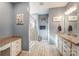 Bathroom featuring double vanities, a glass-enclosed shower, and neutral finishes at 14827 Batteliere Dr, Charlotte, NC 28278