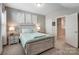 Cozy bedroom with an accent wall and a decorative bed and side tables at 14827 Batteliere Dr, Charlotte, NC 28278
