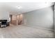 Large bonus room with neutral carpet, desk and chair and large windows at 14827 Batteliere Dr, Charlotte, NC 28278