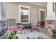 Cozy front porch with rocking chairs and decorative pillows, perfect for relaxing outdoors at 14827 Batteliere Dr, Charlotte, NC 28278