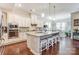 Spacious kitchen with a large center island, barstool seating, and eat-in dining area at 14827 Batteliere Dr, Charlotte, NC 28278