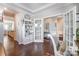 Office space showcases hardwood floors, French doors and neutral decor at 14827 Batteliere Dr, Charlotte, NC 28278