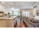 Bright, open concept living space that has a kitchen with a large island and eat in area with a cozy living room at 14827 Batteliere Dr, Charlotte, NC 28278