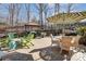 Brick patio with outdoor seating, a grill and a large umbrella at 14827 Batteliere Dr, Charlotte, NC 28278
