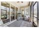 Relaxing screened porch with tile floor and a ceiling fan at 14827 Batteliere Dr, Charlotte, NC 28278