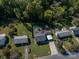 Aerial view of home highlighting the inground pool, deck, fenced yard, mature trees, and convenient carport at 1501 Fern Forest Dr, Gastonia, NC 28054