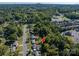 Aerial view of home and neighborhood showcasing a desirable location with mature trees and community amenities at 1501 Fern Forest Dr, Gastonia, NC 28054