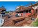 Backyard deck with multiple levels, built-in benches, outdoor seating, and stairs to the upper level balcony at 1501 Fern Forest Dr, Gastonia, NC 28054