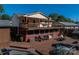 A sprawling backyard deck offers multiple seating areas and perfect for outdoor gatherings and summer BBQs at 1501 Fern Forest Dr, Gastonia, NC 28054