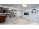 Finished basement with stainless steel appliances, light grey walls, and wood look flooring at 1501 Fern Forest Dr, Gastonia, NC 28054